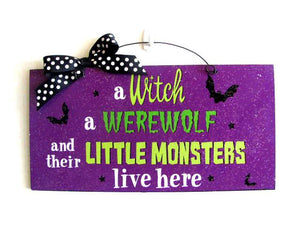 A Witch A Werewolf And Their Little Monsters Live Here Rectangle Wooden Sign Decor With Bow